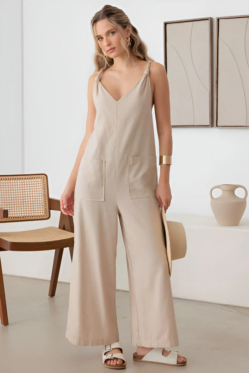 Beige sleeveless wide-leg jumpsuit with V-neckline and rope strap for a boho flowy look