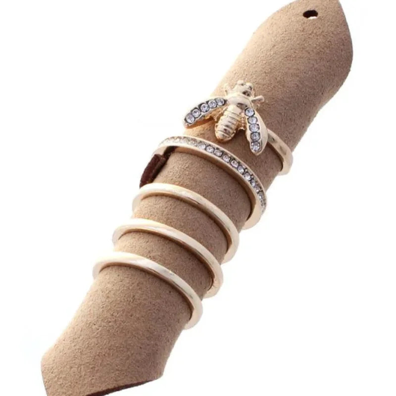 Beige suede ring holder with bee ring set and rhinestones from Shop Daisy