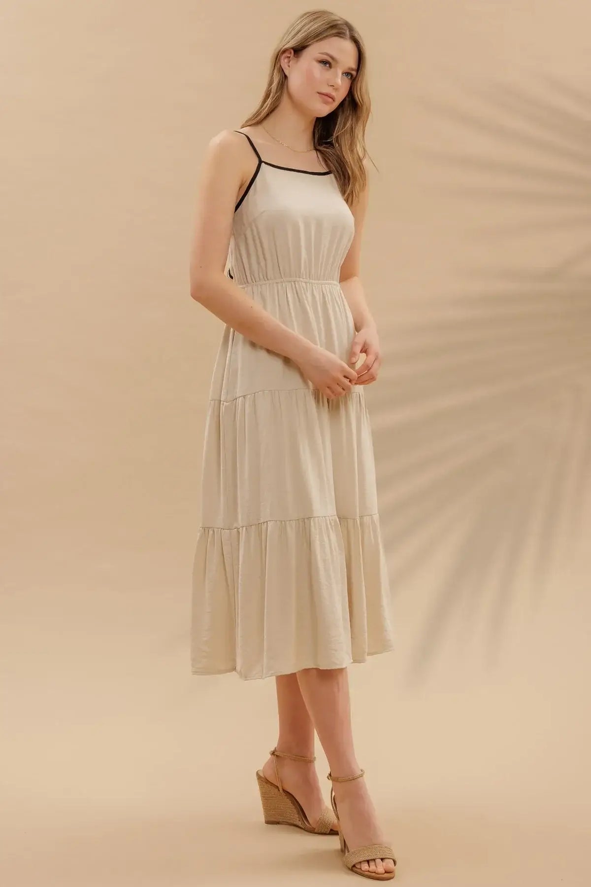 Beige midi dress with black trim from Shop Daisy Women’s Boho Chic Clothing collection