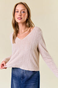 Beige v-neck textured sweater in fuzzy knit from Shop Daisy, ideal for women’s boho chic clothing