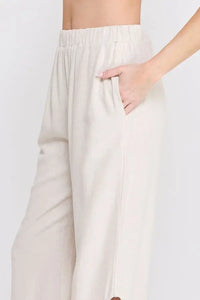 Beige linen elastic waist embroidered pants featuring wide-leg design for a sophisticated look
