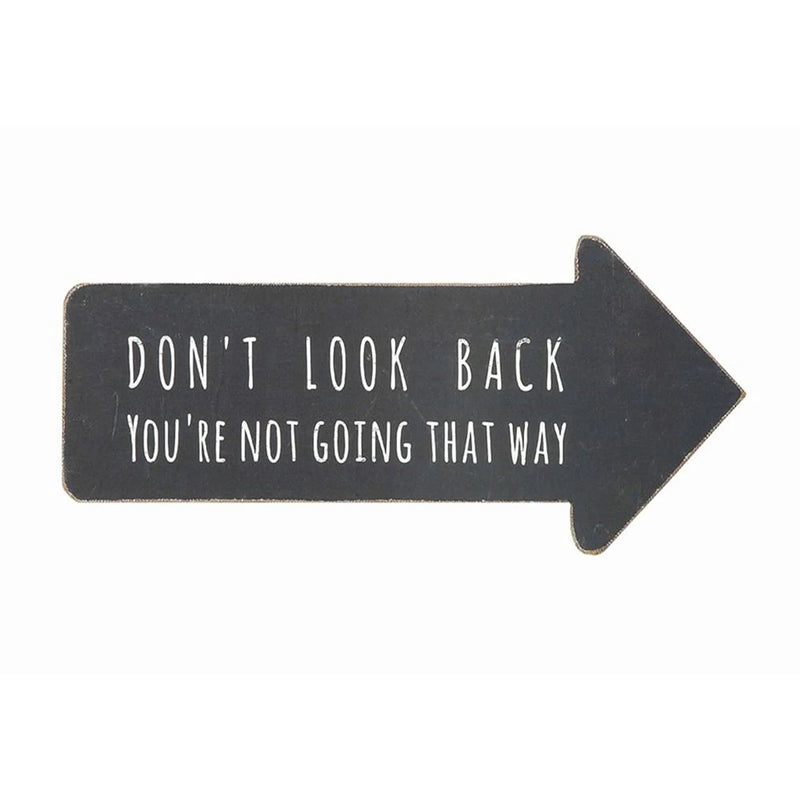 Black arrow wall decor with the phrase Don’t Look Back You’re Not Going That Way