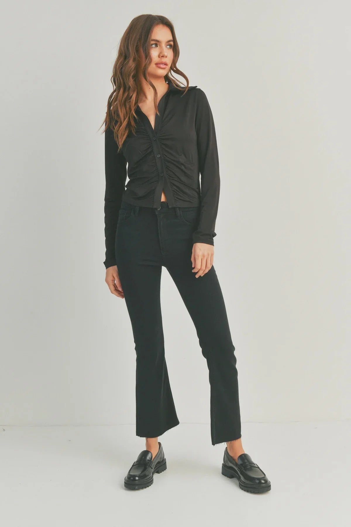 Black cropped jacket with cropped flare denim and loafers for a chic slim fit look