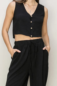 Black cropped vest with buttons and V-neckline for a boho, free spirit style