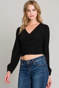 Black cropped wrap sweater with v-neckline from Shop Daisy, perfect for center ruched style