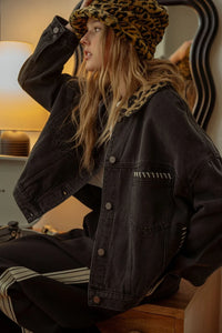 Black denim jacket with leopard collar and white stitching details for stylish appeal