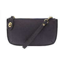 Black faux leather wristlet with card slots from Shop Daisy’s women’s boho chic collection