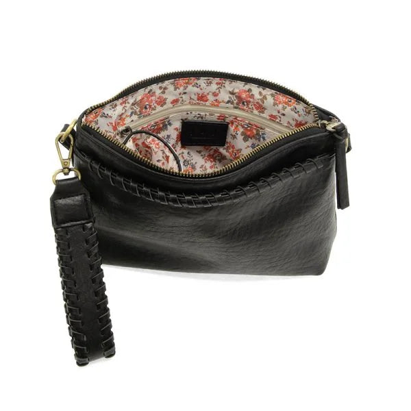 Black vegan leather clutch with floral lining and braided wristlet strap for versatile carrying