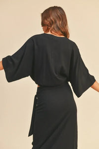 Black boho rayon tied front blouse with wide sleeves and belted waist, shown from the back