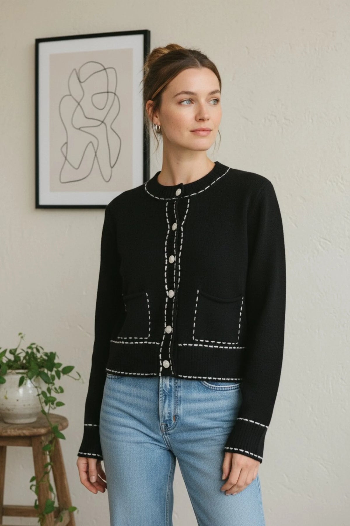 Black long sleeve accent stitch detail cardigan with white stitching and pearl buttons