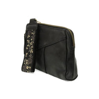 Black vegan leather clutch with floral-embroidered woven wristlet strap and zip closure