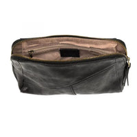 Black leather toiletry bag with zip closure and vegan leather, featuring a woven wristlet strap