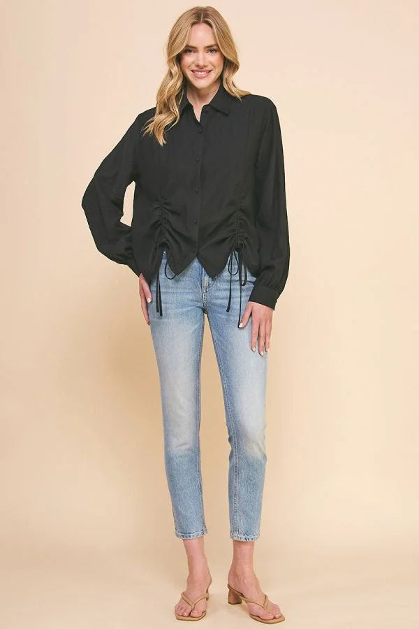 Black long-sleeved woven button blouse with princess seam and tie-front detail