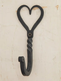 Black metal heart-shaped wall hook from the IRON WALL HOOK collection