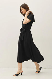 Black midi dress with ruffle cap sleeves and V neck tie waist for elegant style