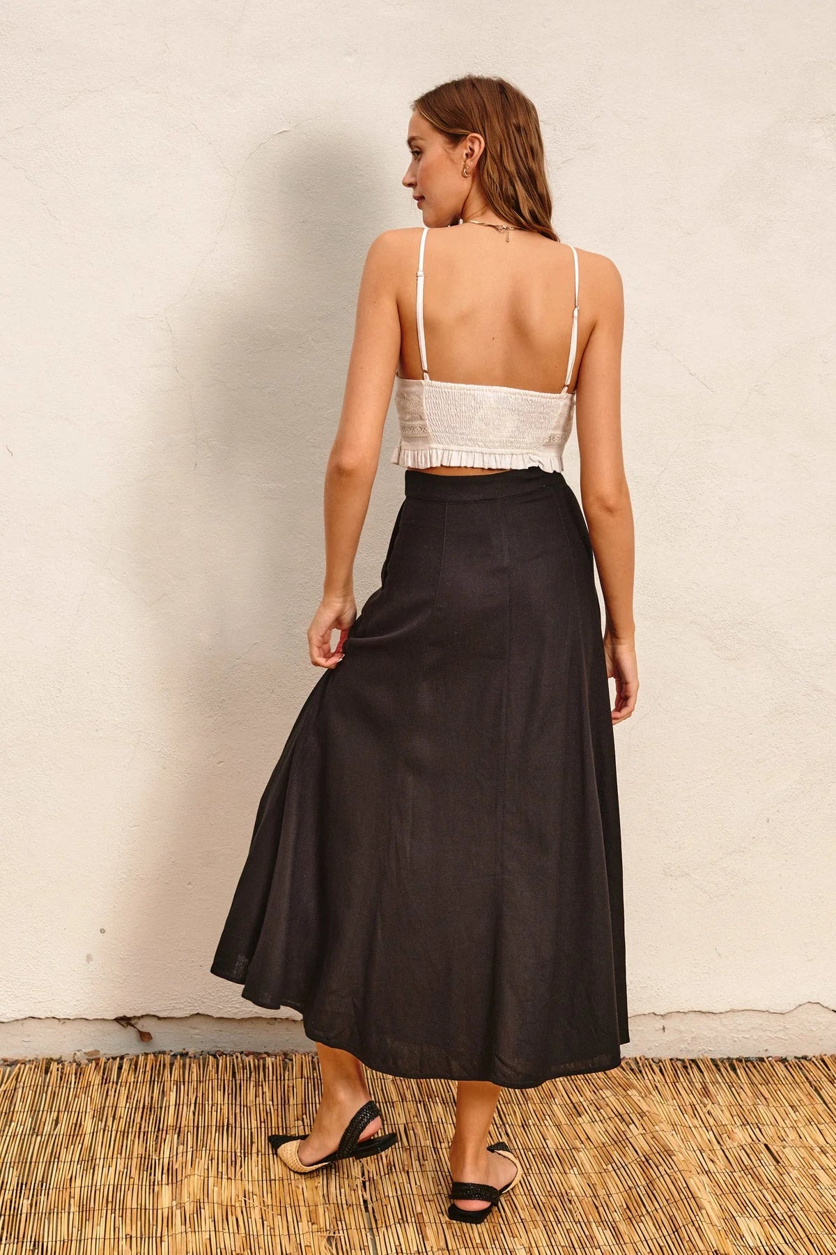 Black High-Waist Flared Maxi Skirt from Heaven Sent, perfect for elegant occasions