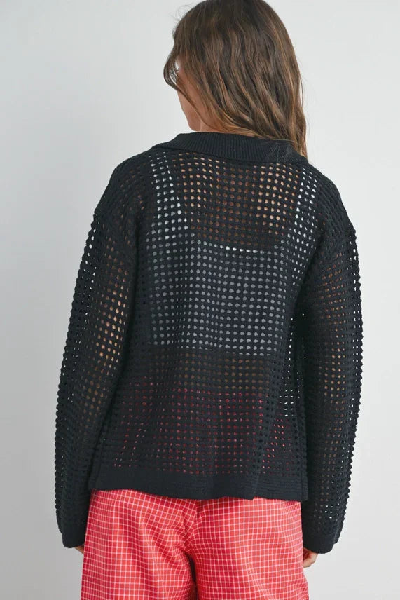 Open stitch crochet collar cardigan layered over white top and red checkered shorts
