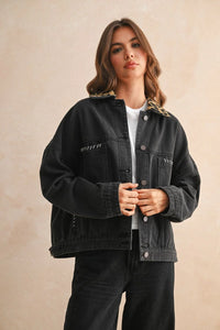 Black oversized denim jacket with leopard print collar and white stitching details