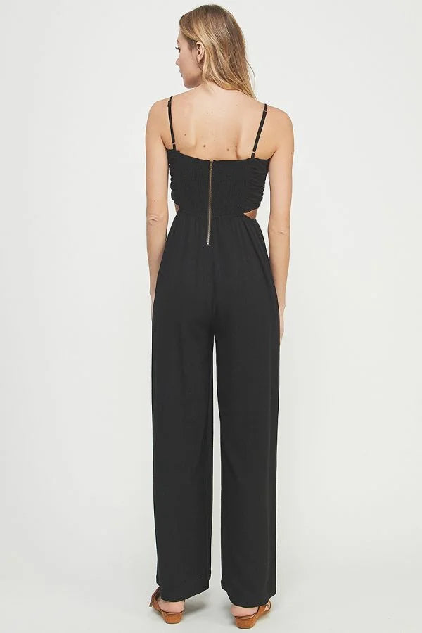 Black sleeveless jumpsuit women in soft linen with spaghetti straps and wide-leg pants, back view