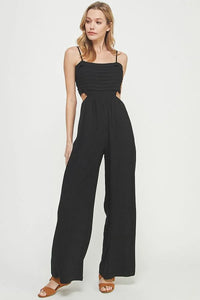 Black sleeveless jumpsuit women in soft linen features wide-leg pants and elegant side cutouts