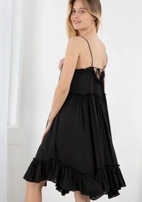 Black spaghetti strap mini dress with ruffled hem, perfect for trendy bohemian style