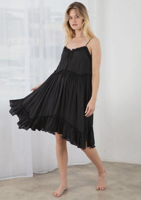 Black spaghetti-strap mini dress with ruffled hem for a trendy bohemian look