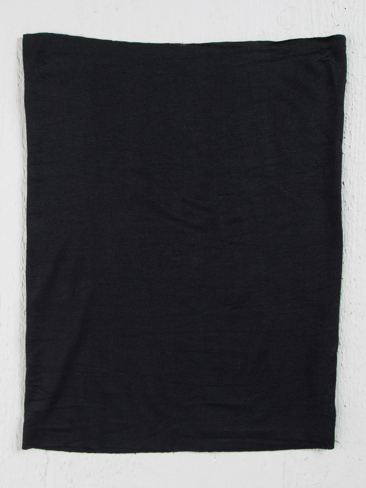 Black T-shirt on white wall showcasing FULL BOHO BANDEAU HEADBAND - BLACK product