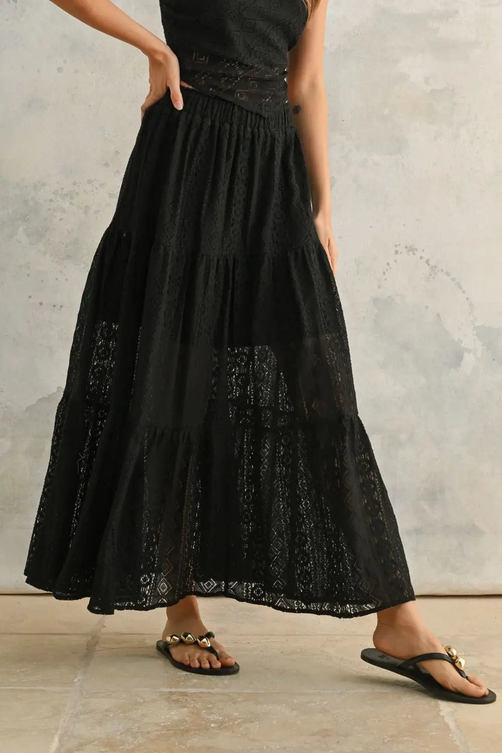 Black crochet lace tiered maxi skirt from BOHO ME featuring intricate eyelet design