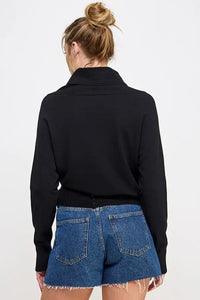 Black turtleneck sweater with denim shorts featuring soft mixed texture design