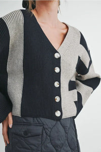 Black and white Marimekko color block button down cardigan with silver buttons