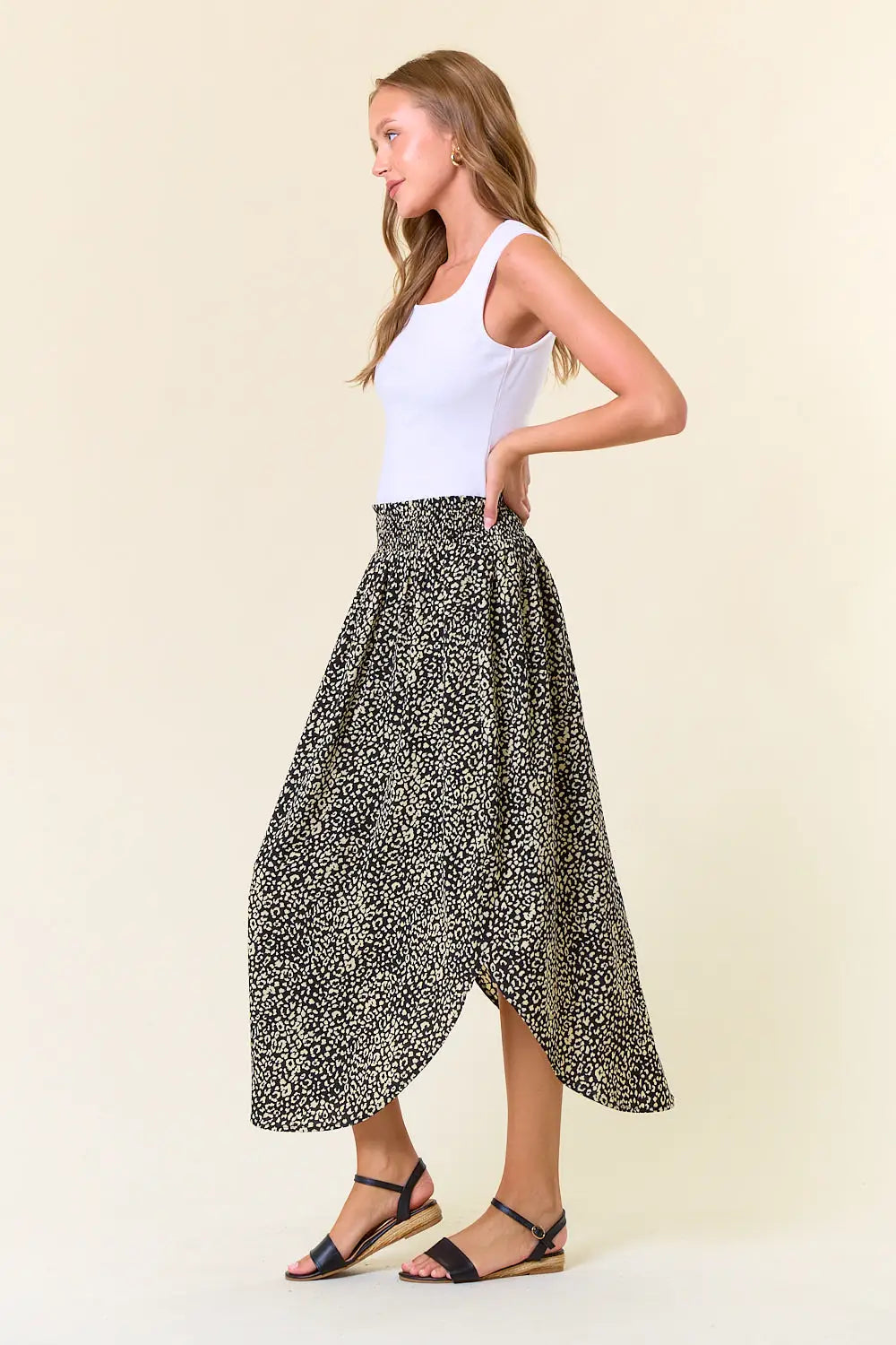 Black and white polka dot midi skirt with asymmetrical hem, part of womens boho clothes