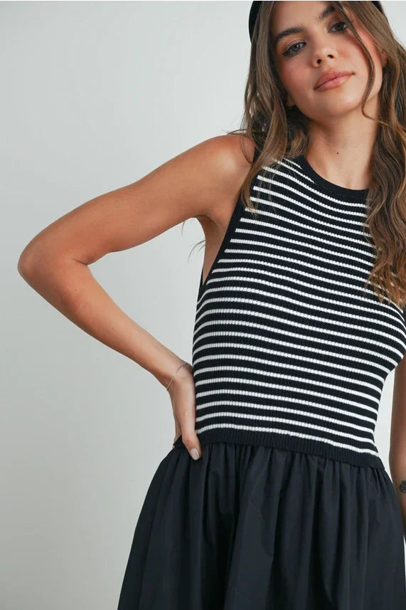 Black and white striped sleeveless maxi dress with flared skirt