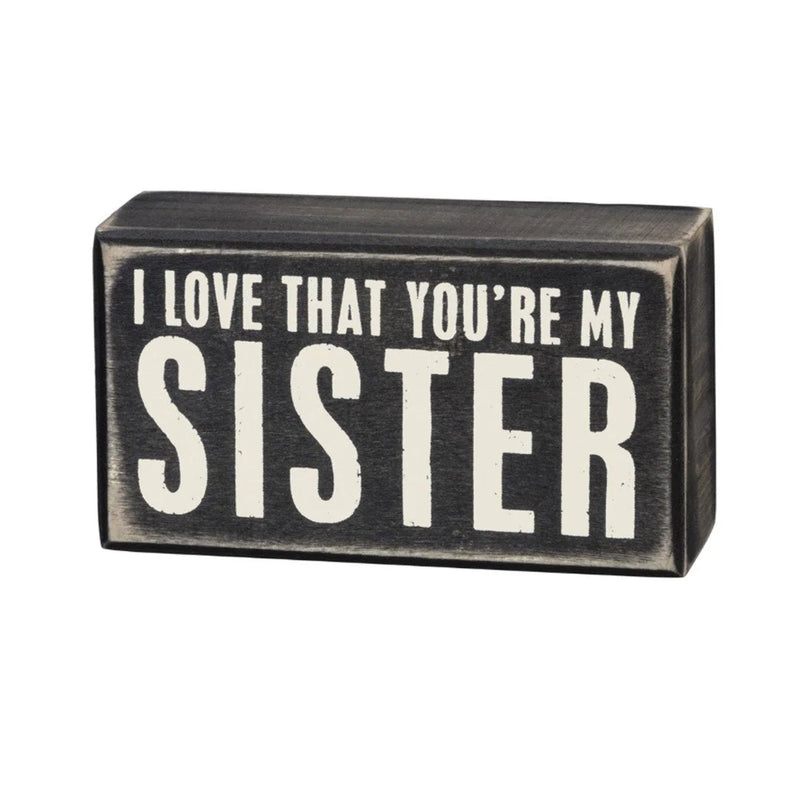 Black and white wooden sister box sign featuring the phrase I love you’re sister