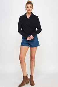 Black soft mixed texture wrap sweater with shawl collar, styled with denim shorts and ankle boots