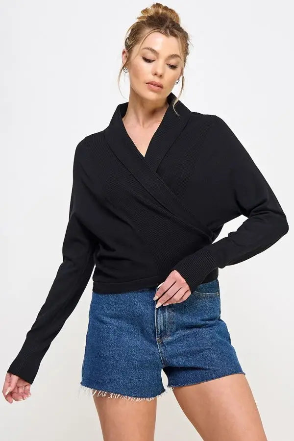 Black wrap-style sweater with long sleeves and v-neckline in soft mixed texture