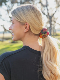 Blond woman with ponytail wearing Full Boho Bandeau Headband in a park setting