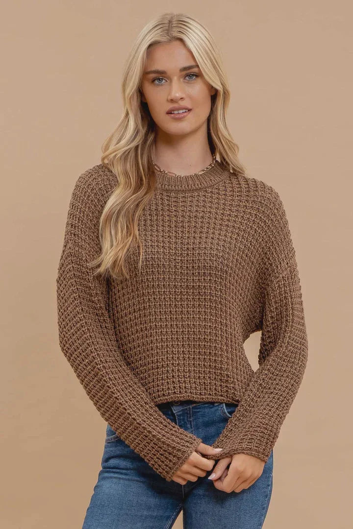 Blonde woman showcasing the Sheer Crew Neck Crochet Knit Sweater from Shop Daisy