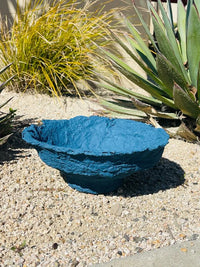 Blue bowl atop gravel showcasing a Decorative Handmade Paper Mache Bowl