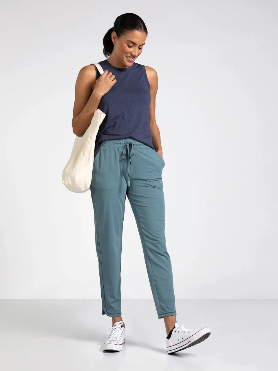 Thread and Supply Harla Pants in blue with white Converse sneakers