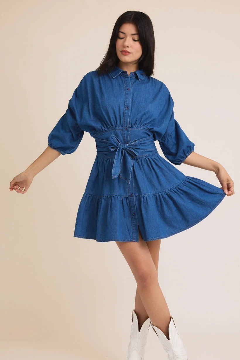 Blue denim 3/4 sleeve mini dress with puff sleeves and waist tie from Shop Daisy