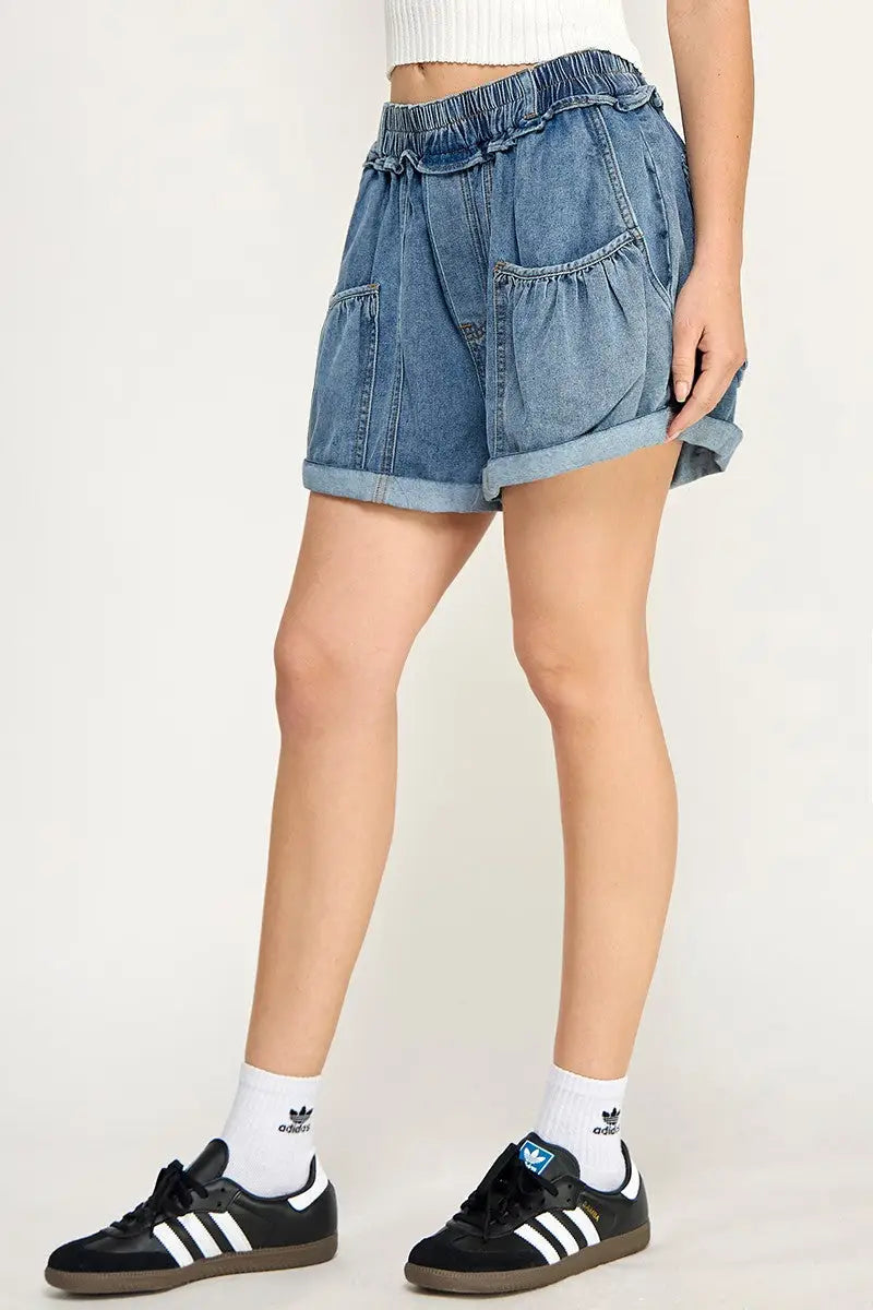 Blue denim shorts with elastic waistband and balloon style pockets for casual comfort