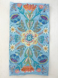 Blue floral patterned towel featured in FULL BOHO BANDEAU HEADBAND by Shop Daisy