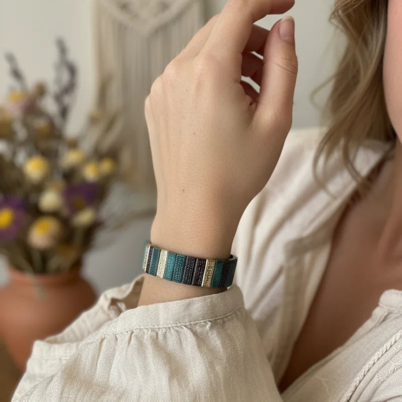 Earthy textured bohemian bracelet in blue green striped leather with silver accents