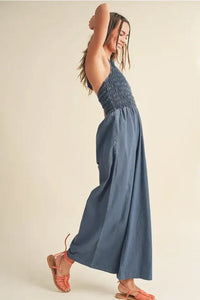 Blue halter-neck jumpsuit from Shop Daisy, perfect for women’s boho chic clothing