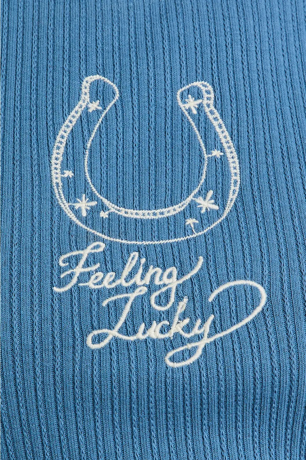 Blue ribbed fabric with horseshoe embroidery on Shop Daisy Lane’s EMBROIDERY DETAIL RIB TANK TOP