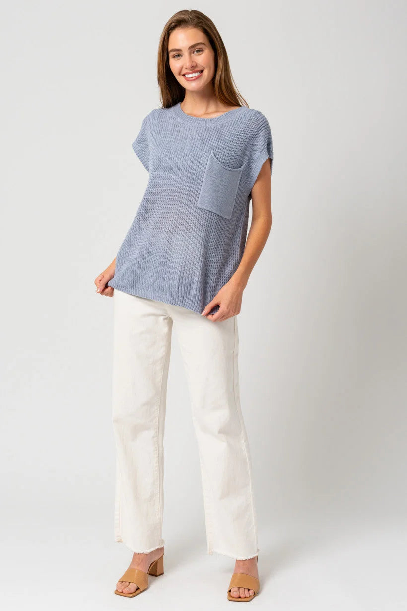 Blue short-sleeved knit top with pouch pocket for women’s boho chic clothing at Shop Daisy