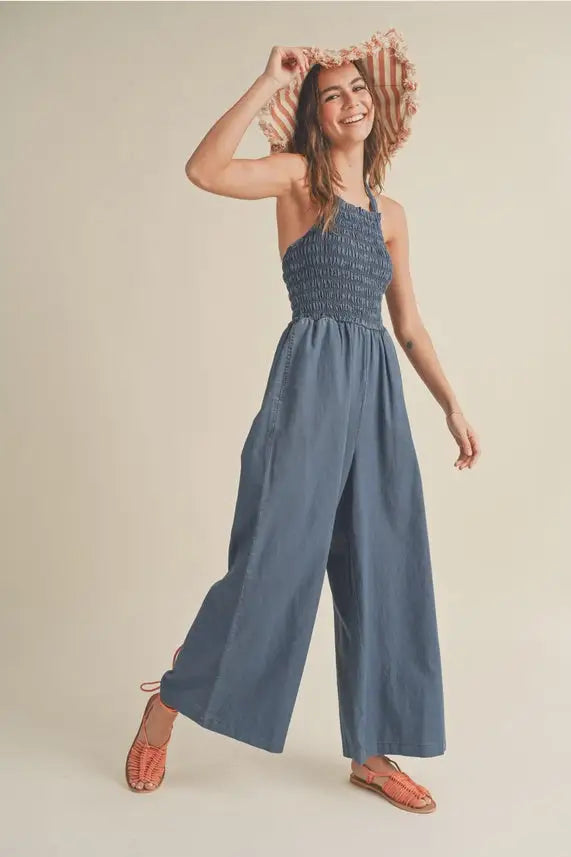 Blue smocked halter jumpsuit showcasing Women’s Boho Chic Clothing from Shop Daisy