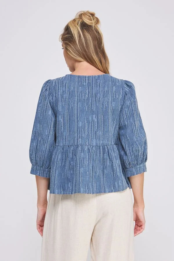 Blue striped peplum blouse with puff sleeves in textured cotton blend for a stylish look