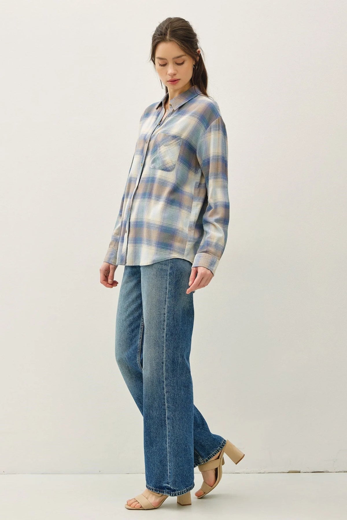 Vintage plaid boxy shirt featuring blue, white, and brown flannel with collar and chest pocket