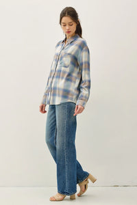Vintage plaid boxy shirt featuring blue, white, and brown flannel with collar and chest pocket